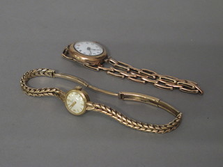A lady's gold cased wristwatch with integral bracelet and 1 other gold cased wristwatch