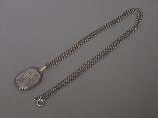 An engraved silver locket hung on a fine silver chain