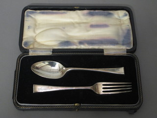 A 2 piece silver christening set with fork and spoon, Sheffield  1926 and 1929, 2 ozs, cased