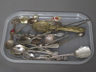 A collection of various enamelled and other souvenir spoons