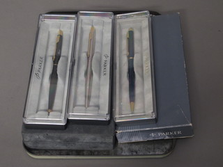 A modern black Parker Duofold fountain pen with 18ct gold nib, boxed, a Parker Sonnet-Signia 88 fountain pen and a roller ball  ben, boxed and 3 Parker ballpoint pes