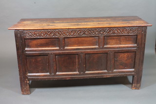 An 18th/19th Century carved oak coffer of panel construction  56"
