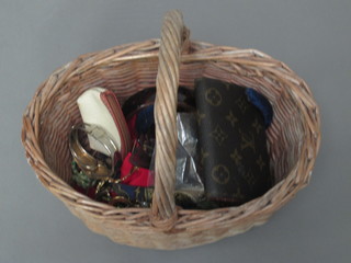 An oval wicker basket containing a collection of costume  jewellery