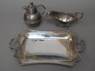 A rectangular silver plated twin handled dish, do. Jersey milk carrier and cream jug