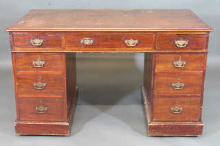 A 19th Century mahogany kneehole pedestal desk with inset  tooled leather writing surface above 1 long and 8 short drawers  49"