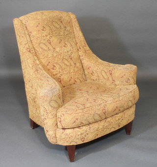 A Georgian style mahogany framed armchair upholstered in  brown material