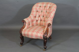 A Victorian carved mahogany show frame tub back chair  upholstered in tartan material, raised on cabriole supports