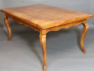 A French cherrywood farmhouse drawleaf dining table, raised on cabriole supports 70"