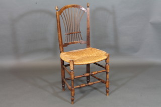 A camel shaped bedroom chair with woven cane back and  upholstered seat, raised on turned supports