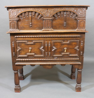 A rectangular carved oak box with arcaded decoration, raised on  a side table fitted 1 long drawer, raised on turned and block  supports