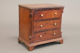 A 19th Century Continental mahogany apprentice style chest with  crossbanded top and canted corners, fitted 3 long drawers, raised  on bracket feet 10"