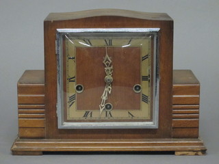 An Art Deco chiming mantel clock with square dial contained in  a walnut case by Smiths