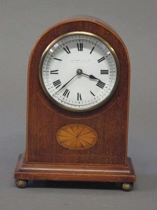 A bedroom timepiece with enamelled dial and Roman numerals  contained in an arch shaped inlaid mahogany case  ILLUSTRATED