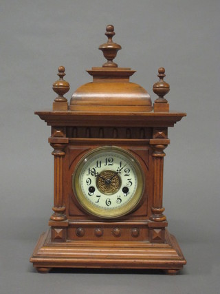 A 19th Century 14 day striking bracket clock with enamelled dial  and Arabic numerals contained in a walnut case