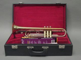 A brass trumpet marked B & S Sonora