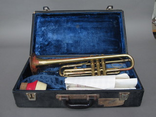A brass trumpet marked B & M Champion, cased