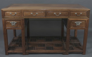 An Oriental hardwood pedestal side table fitted 4 drawers, the pedestal fitted 1 drawer with pierced undertier 57"