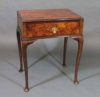 An Art Deco figured walnut side table fitted a drawer, raised on cabriole supports 23"