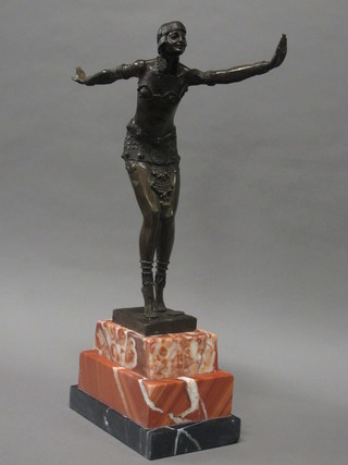 An Art Deco style bronze figure of a dancing girl, raised on a rectangular stepped marble base 19"