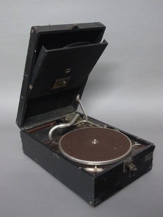 An HMV manual gramophone contained in a fibre carrying case