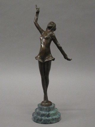 A Art Deco style bronze figure of a dancing girl, raised on  stepped green marble base 16"