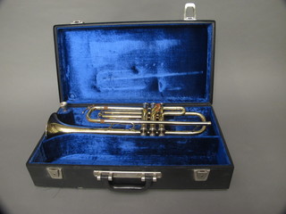 A brass trumpet marked B & M Champion