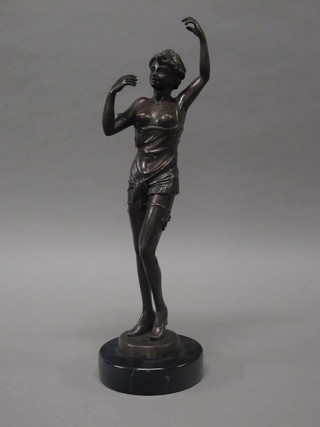 An Art Deco style bronze figure of a standing semi-naked lady,  raised on a marble base 16"