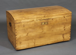 A Continental dome shaped stripped and polished pine coffer with hinged lid and iron drop handles 35 1/2"