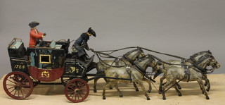 An Antique wooden model of a stage coach drawn by 4 horses   ILLUSTRATED
