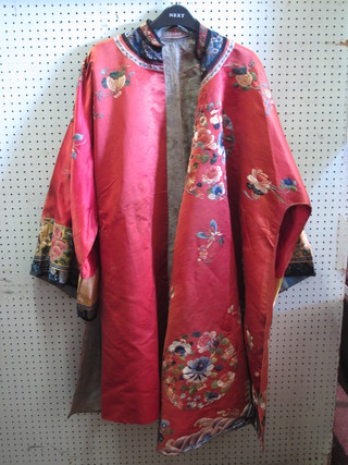 An orange silk embroidered Kimono