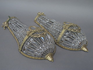 A pair of gilt metal and glass wall light brackets of shaped form 19"