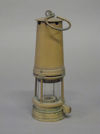A Miner's brass safety lamp