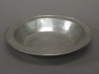 A circular pewter dish, the base with touch marks 8 1/2"