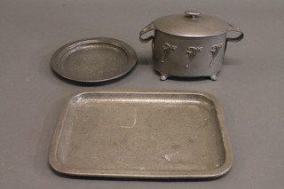 An Art Nouveau oval Civic Pewter twin handled biscuit barrel raised on splayed feet, the base marked 841, 6 1/2",  a  rectangular planished pewter tray 12" and do. dish 8",