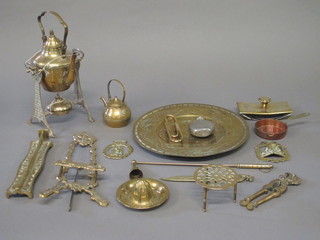 A brass spirit kettle and stand, an Oriental brass charger and  other brass items