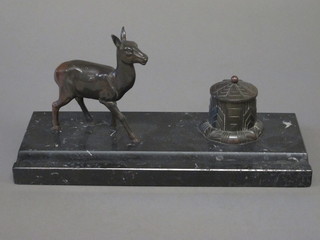 An Art Deco spelter and marble inkwell decorated a deer, raised  on a black marble base 12"