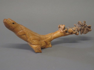 A carved wooden figure of a lizard 18"