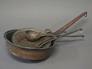 An Eastern copper saucepan with iron handle, 2 Eastern bowls and 3 copper implements