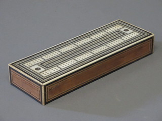 An Eastern boxwood and mother of pearl cribbage board
