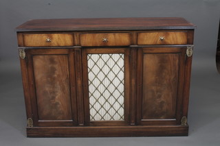 A Georgian style mahogany sideboard fitted 3 long drawers above a triple cupboard, the centre section enclosed by a grilled  panelled door, raised on a platform base 48"
