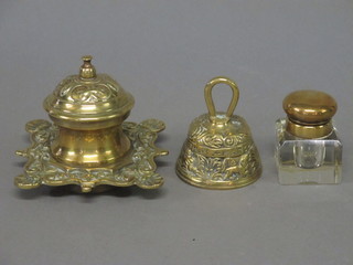 A square cut glass inkwell with hinged gilt metal lid 2", 1 other inkwell and a small table bell
