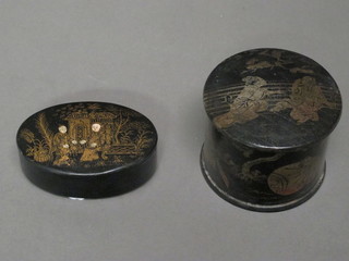 A circular black lacquered Oriental box 2" and an oval ditto 3"