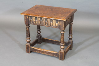 A rectangular carved oak joyned stool raised on turned and block supports 19"