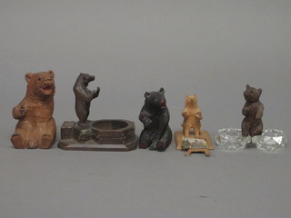 A Swiss carved wooden figure of a seated bear 4", 1 other, a  glass salts surmounted by a figure of a bear and 2 other bears