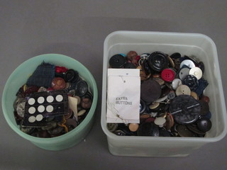 2 plastic containers containing a collection of buttons