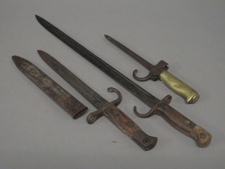 A French bayonet with 6 1/2" blade together with a 1907  Continental bayonet with 17" blade, no scabbard and 1 other Continental bayonet, blade corroded complete with scabbard
