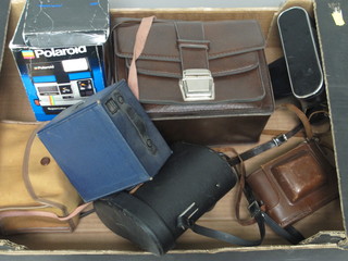 A Zenit-E camera and a collection of cameras