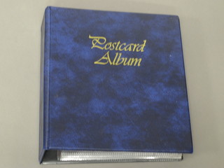 A blue ring bind album of various postcards - Royalty