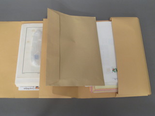 A yellow folder of various loose British stamps and 1 other of World stamps