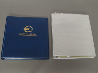 A Euro-Borlaufer blue leaf album of various stamps and a ring  bind album of various stamps